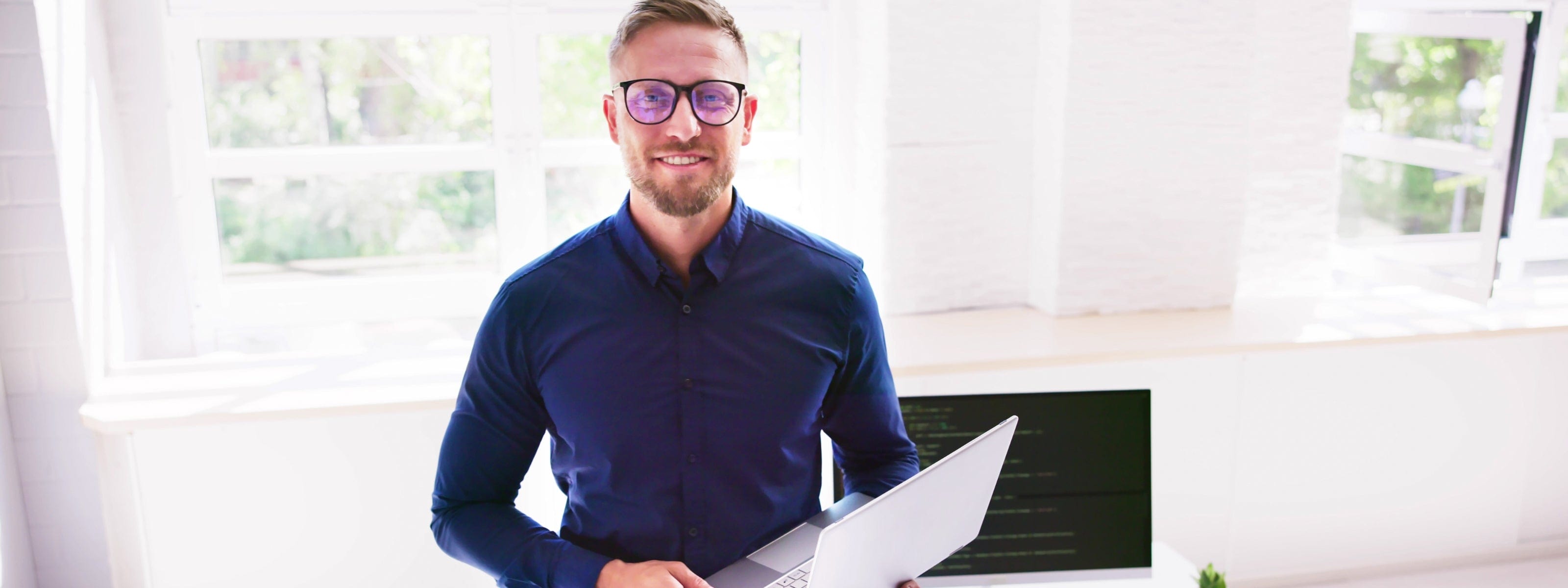 Mindful Rental Pros customer happy in a blue shirt